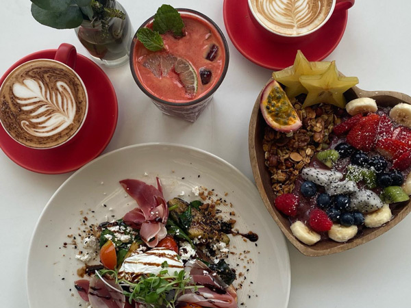 a spread of food and coffee at the Foreshore Restaurant & Cafe, Darwin