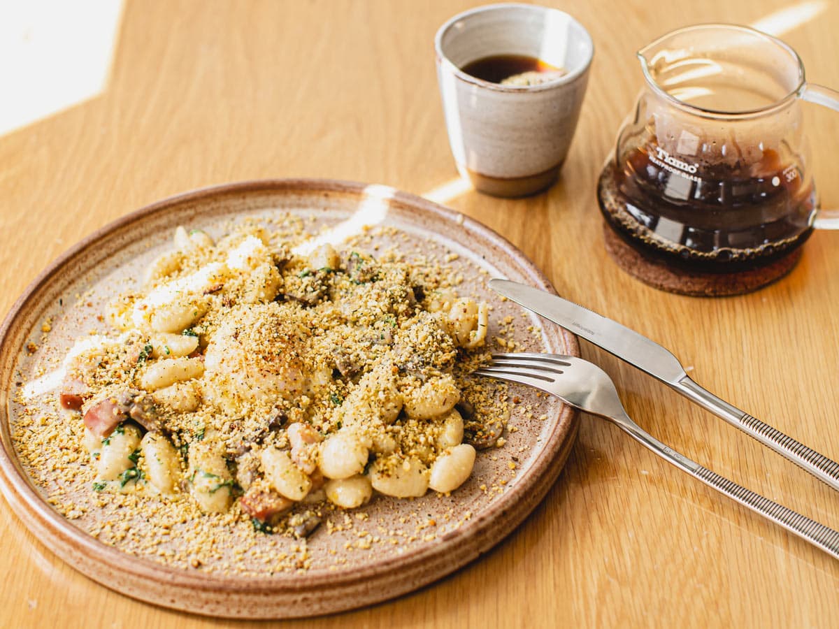 The Breakfast Carbonara with a long black coffee from Morning After in Brisbane