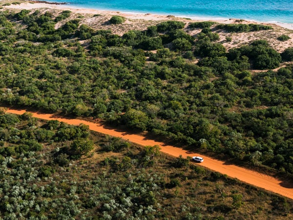 Car dricing along dirt road in Broome