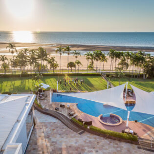 an aerial view of the beach and pool at Mindil Beach Casino Resort Darwin