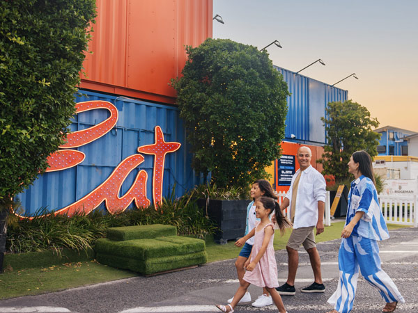 a family walking towards Eat Street Northshore
