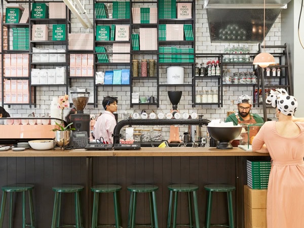 a woman ordering at the counter of Hardware Société cafe in Melbourne CBD