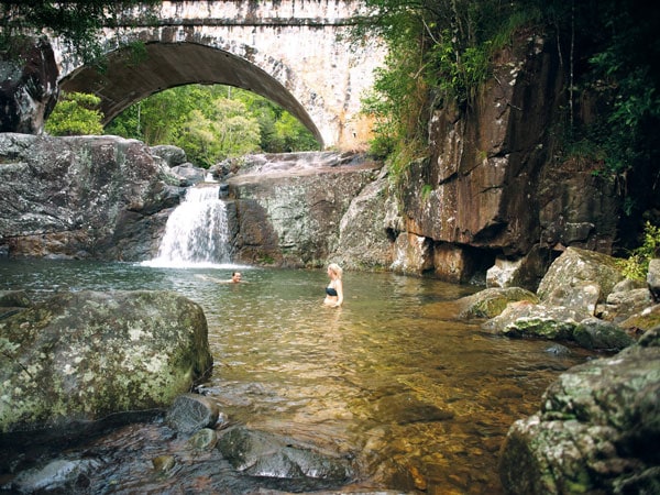 A couple swim at Little Crystal Creek