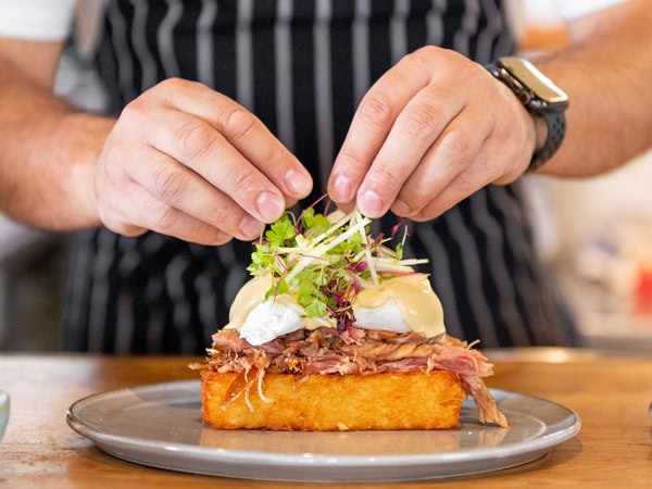 a chef decorating a dish at Mammoth, Armadale