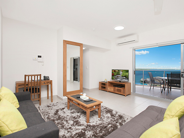 a lounge with a harbour view at Ramada Suites By Wyndham Zen Quarter, Darwin