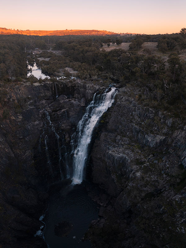 Sun rising over Apsley Falls in Oxley Wild Rivers National Park, Walcha
