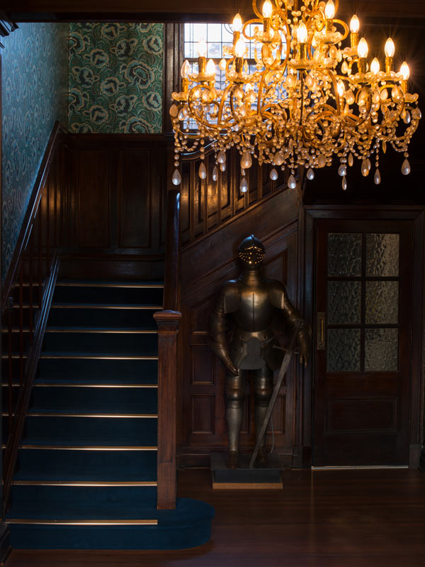 Chandelier stairs and suit of armour at Aspinalls in Bowral