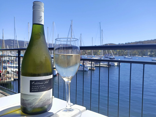 a glass of Tasmania pinot gris overlooking the marina at Bruny Island Gateway Cafe