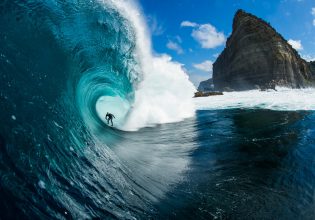 Surfer riding a wave at Shipstern Bluff