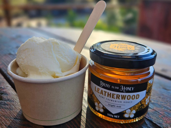 a cup of honey ice cream beside a jar of Bruny Island honey