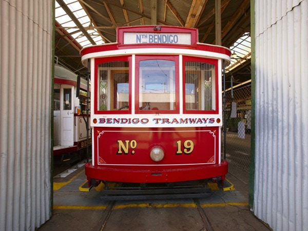 a photo of a red Vintage Talking Tram in Bendigo