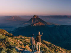 Two men at the top of Mount Barney after hike in Brisbane