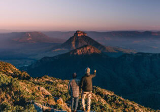 Two men at the top of Mount Barney after hike in Brisbane