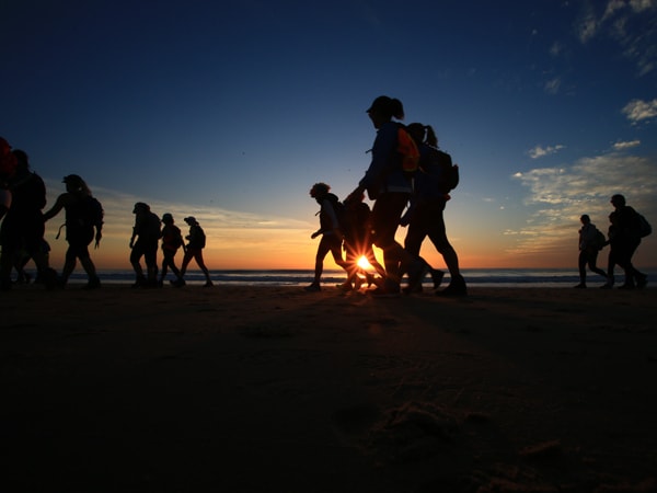 People walking at Twilight doing Coastrek walk