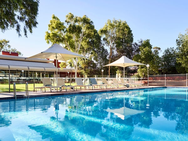 a huge outdoor pool at Desert Gardens Hotel