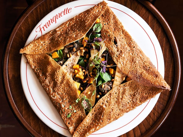 a plate of vegan crepe at Franquette Crêperia