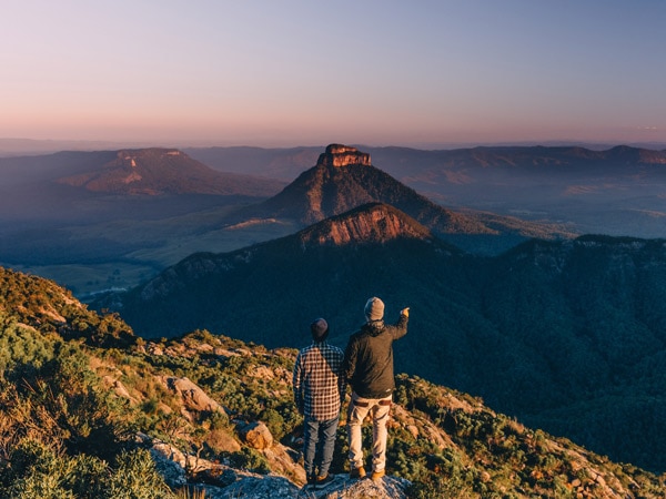 Two men at the top of Mount Barney after hike in Brisbane