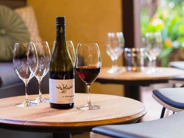 Bottle of red on tabel at Woodstock Wine in McLaren Vale