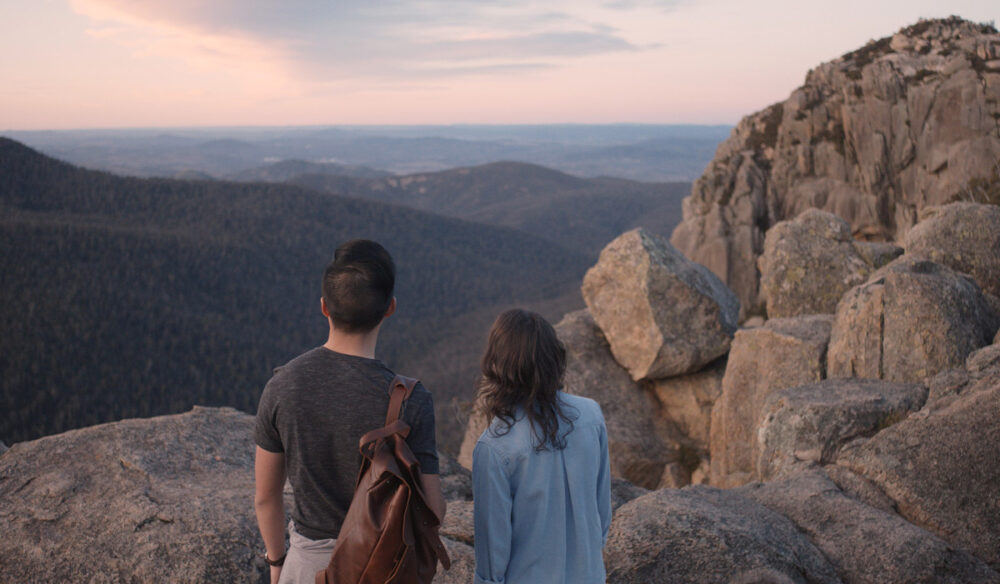 a couple standing atop Booroomba Rocks, Namadgi National Park