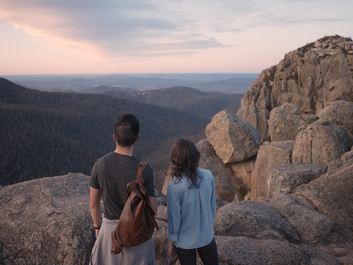 a couple standing atop Booroomba Rocks, Namadgi National Park