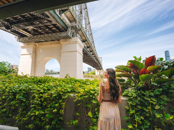 Woman in dress under the Story Bridge at Crystalbrook Vincent