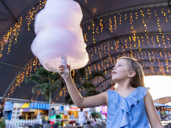 a little girl holding a cotton candy at Eat Street Northshore