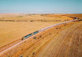 the Indian Pacific train traversing the vast and dry landscape of Clare Valley