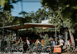 front view of Sixpence Coffee filled with customers
