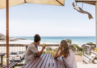 Couple having a schooner each at the Wye Beach Hotel on the Great Ocean Road