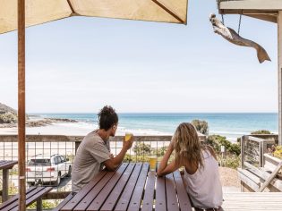 Couple having a schooner each at the Wye Beach Hotel on the Great Ocean Road