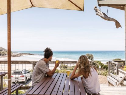 Couple having a schooner each at the Wye Beach Hotel on the Great Ocean Road