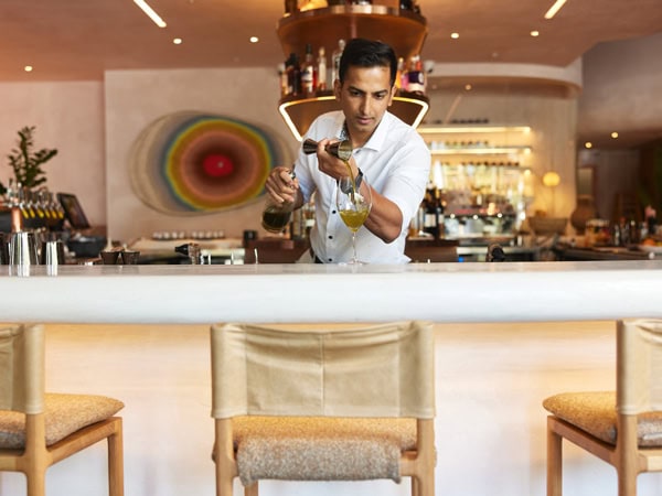 a mixologist preparing a cocktail at Hurricane’s Bar & Grill, Cronulla
