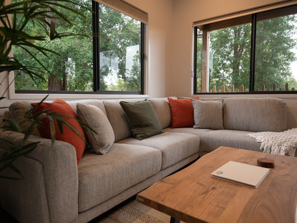 a cosy sofa at Red Kangaroo Cabin