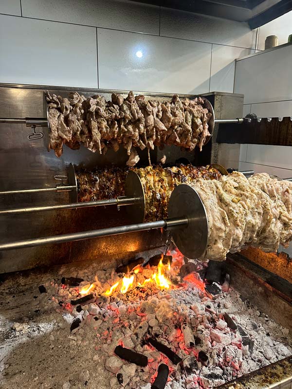 meat roasting over charcoal at Lamb on Gavan