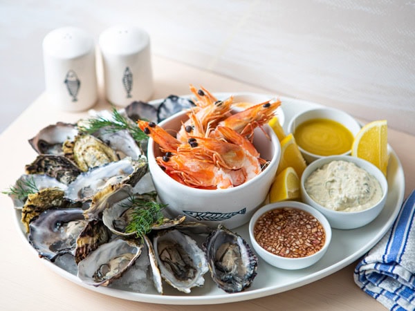 oysters and shrimps on a plate at One Fish Two Fish, Brisbane