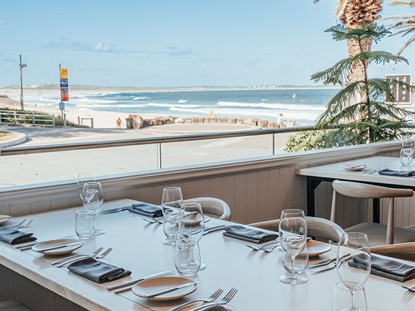 A table overlooking North Cronulla Beach