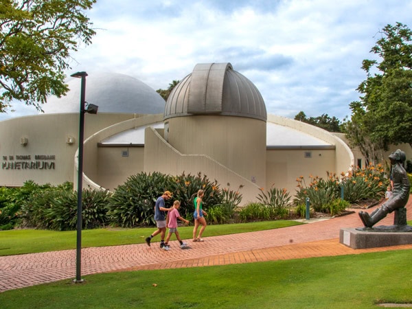 a family visiting the Sir Thomas Brisbane Planetarium