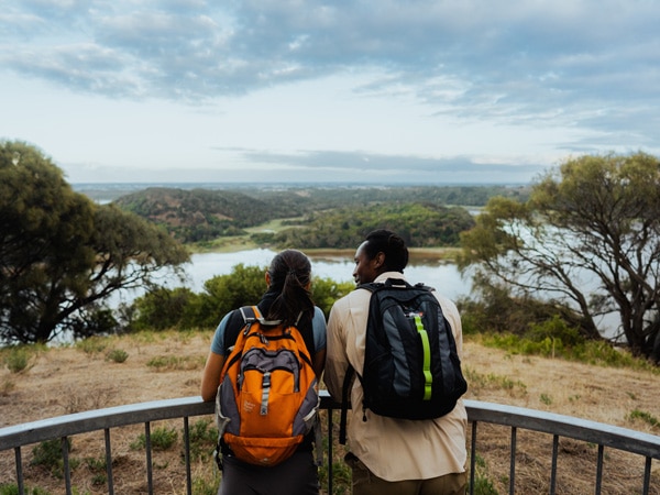 a couple looking out at the stunning landscape from the Tower Hill