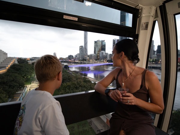 a mother and son riding the Wheel of Brisbane