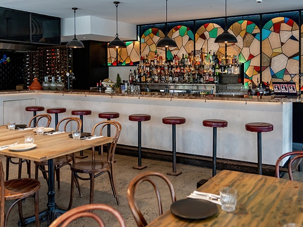 The bar at Yalla Sawa has a stunning stained-glass backdrop. 