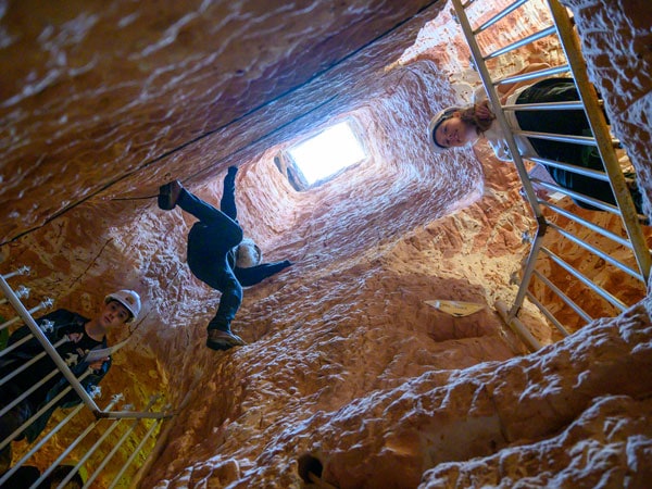 visitors at the Old timer's Mine looking down from above