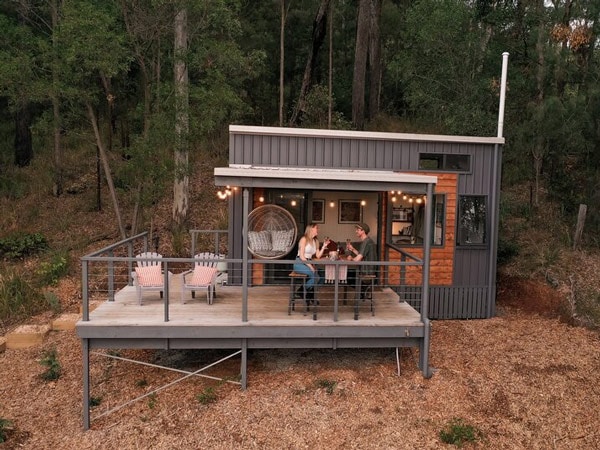 a couple having a dinner date at an elevated outdoor deck