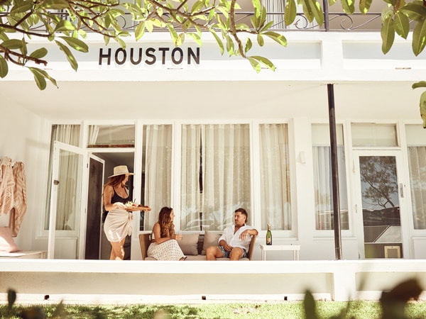 three people hanging out at the al fresco deck
