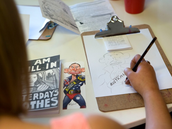 a woman sketching on paper