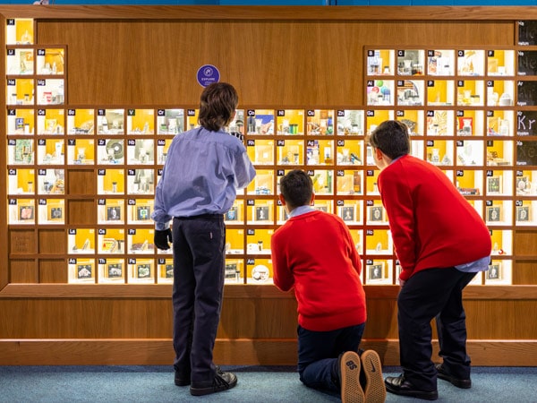kids looking at the giant periodic table inside Questacon