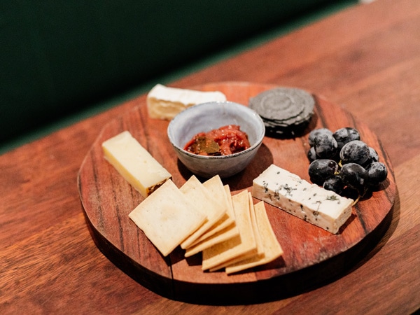 a cheese and charcuterie board at Rosella's