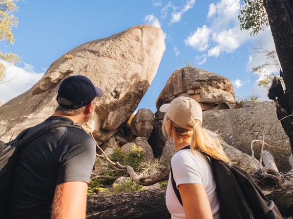 a couple encountering rock slabs in Stanthorpe Girraween Mt Norman Trail