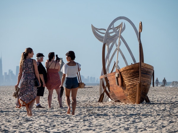 visitors getting mesmerised at an art installation during the Swell Sculpture Festival