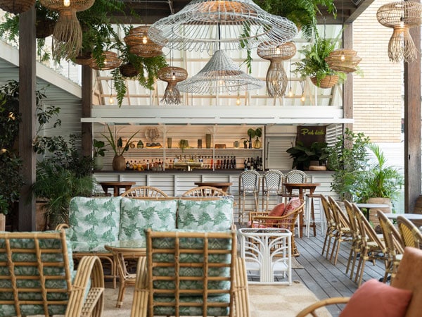 a tropical-themed interior at The Island Rooftop bar
