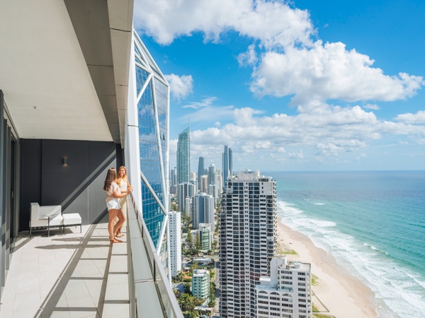 two women admiring the beachfront views from the balcony at The Langham Gold Coast
